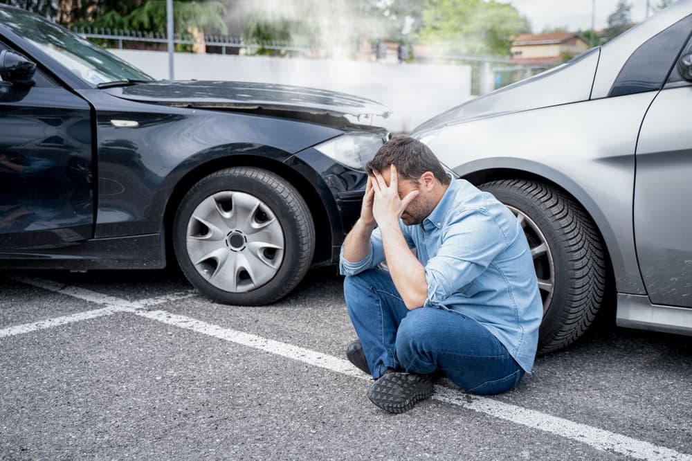 A single individual experiencing pain following a car accident injury.






