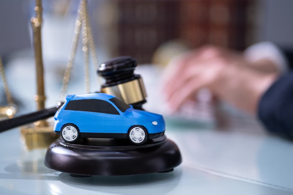 A lawyer discussing car insurance legislation in the courtroom.