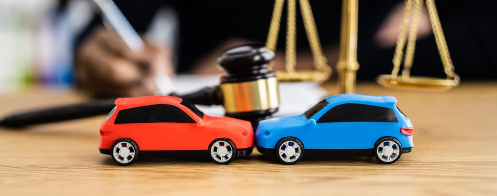 Car accident liability insurance and lawyer or judge.