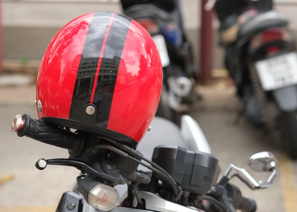 Helmet with red polish reflecting a hat.






