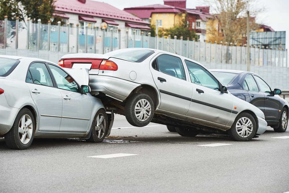 Street collision involving damaged vehicles.