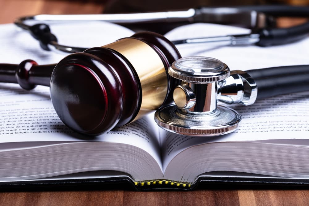 A Judge's Gavel and Stethoscope on Dog Bite Law Book