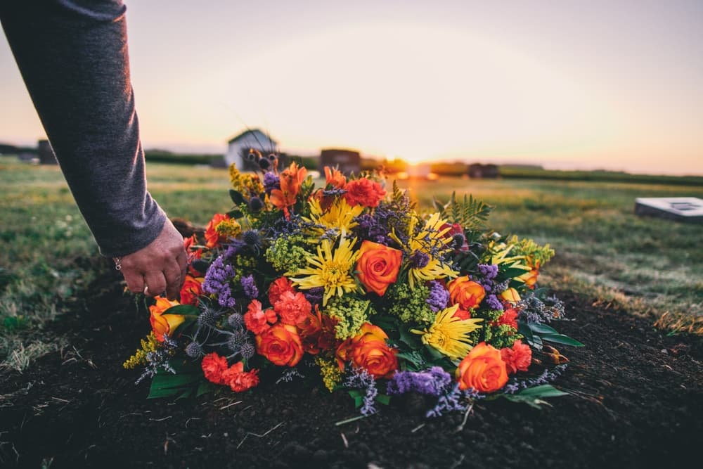 Funeral flowers in a sunset